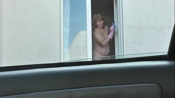 Bare And Unaware: A Busty Mature Neighbor Cleans Her Windows Completely Naked As A Cab Driver Gazes From The Street
