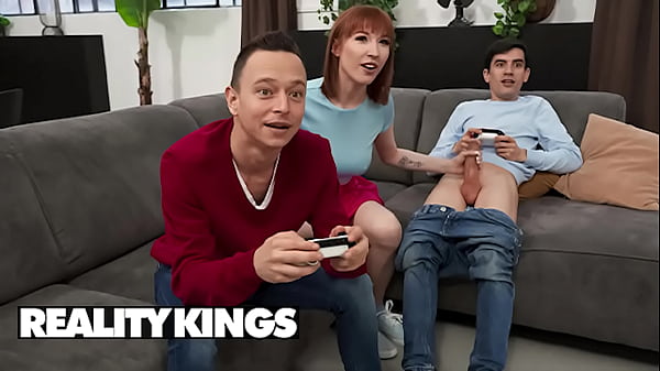 Reality Kings – Lilly Mays Slinks Away With Jordi For A Quick, Dirty Fuck While His Buddy’s Too Busy Gaming To Notice.